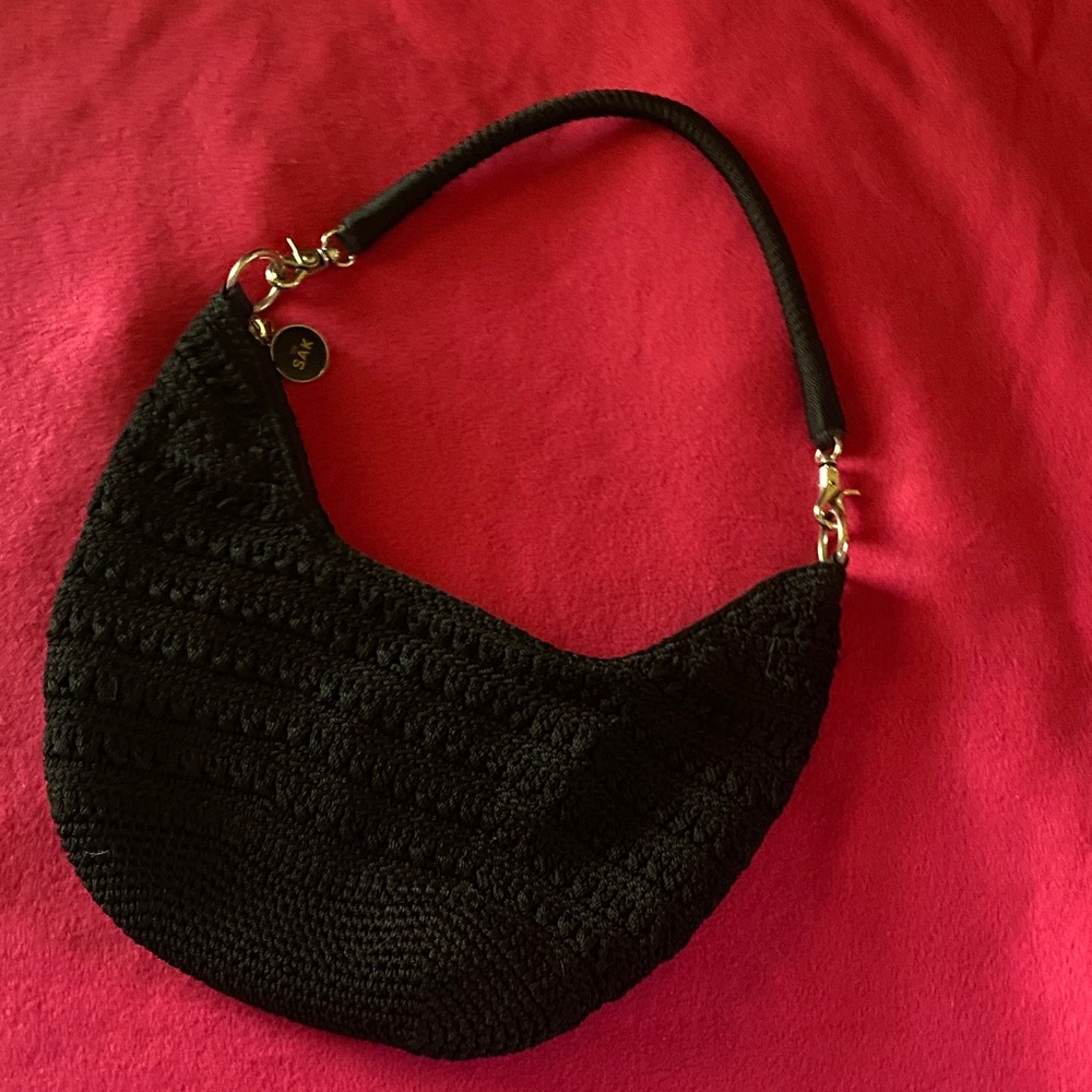 Black crochet hobo shoulder bag by The Sak